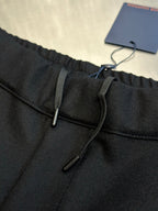 Louis Vuitton dark pants front with drawstring and metal zipper detail