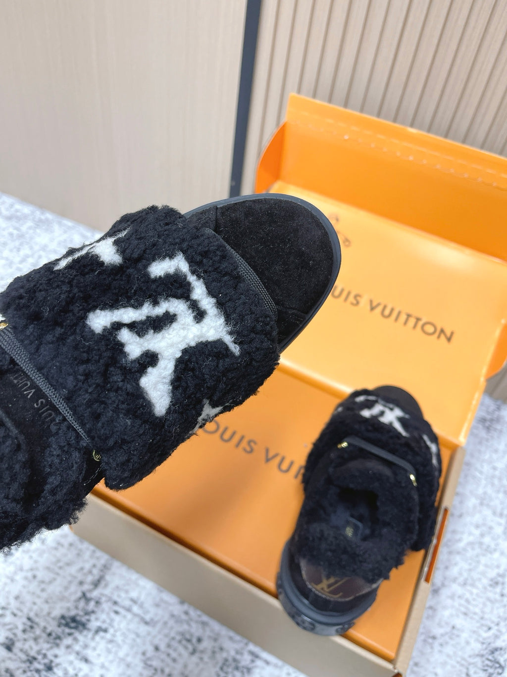 Louis Vuitton black plush slip-on sneakers with white star emblem and strap