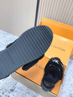 Louis Vuitton black plush slip-on sneaker with ribbed outsole and white star logo