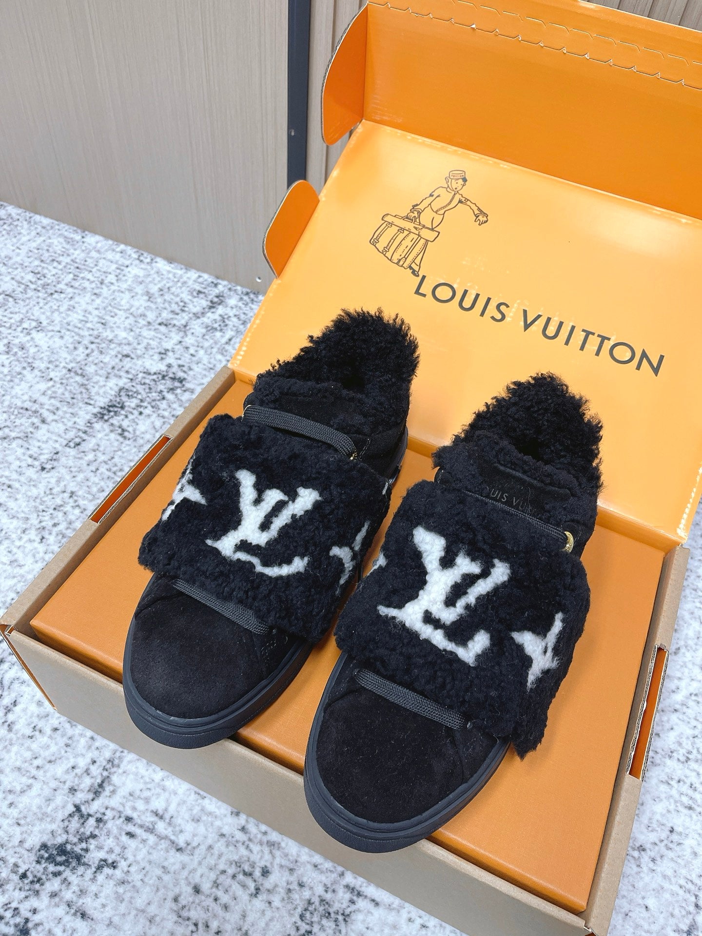 Louis Vuitton black plush slip-on sneakers with white star print and strap