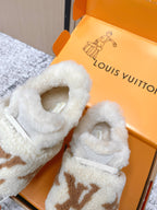 Shearling slip-on sneakers, close-up of light gray fur lining and tan monogram