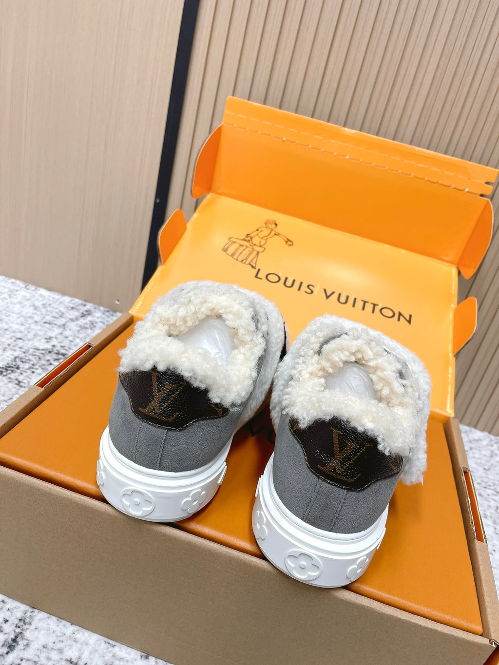 Louis Vuitton unisex sneakers, gray low-tops with white sherpa lining and black heel patch