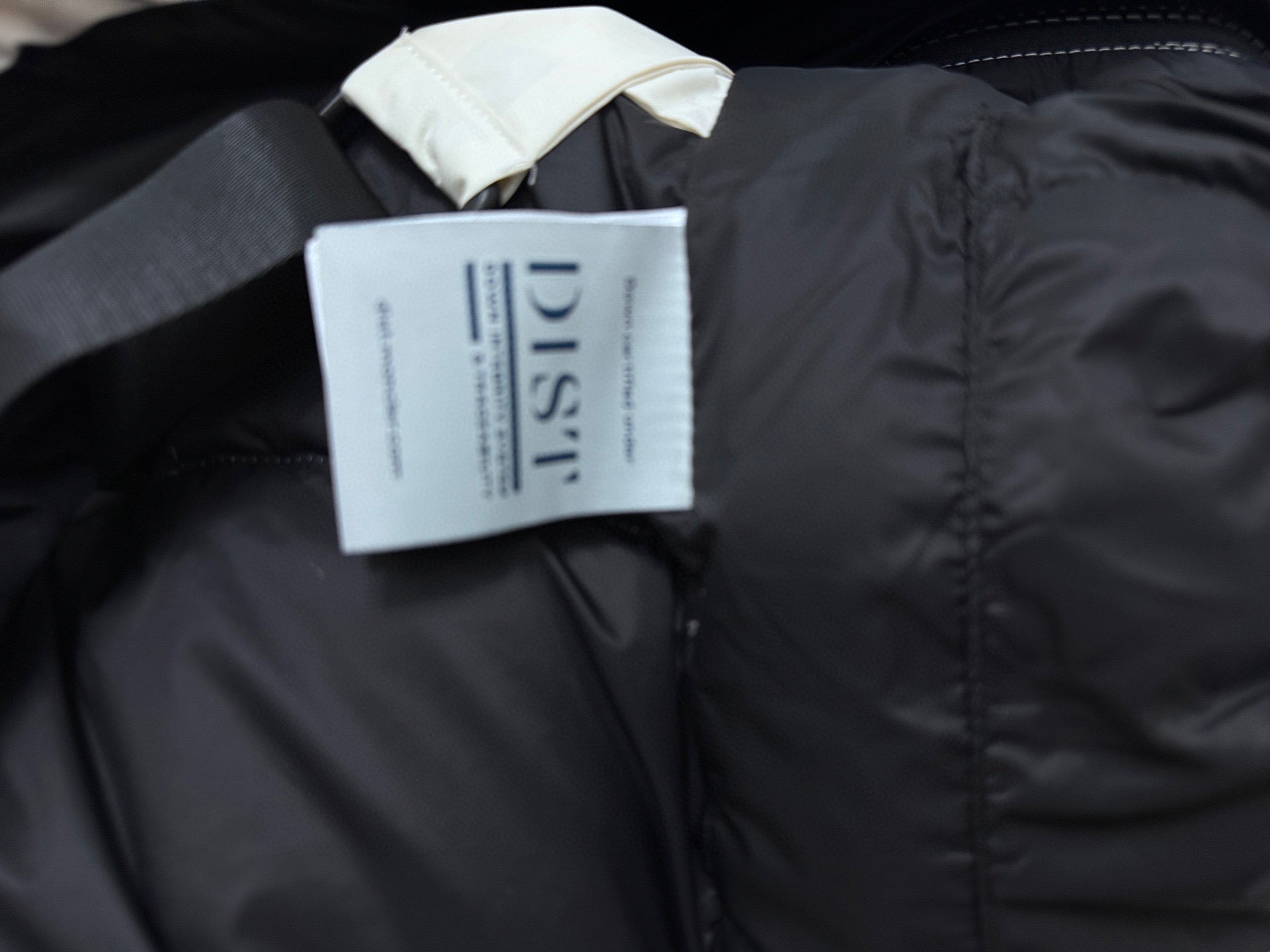Moncler black puffer jacket with hanging label and high collar