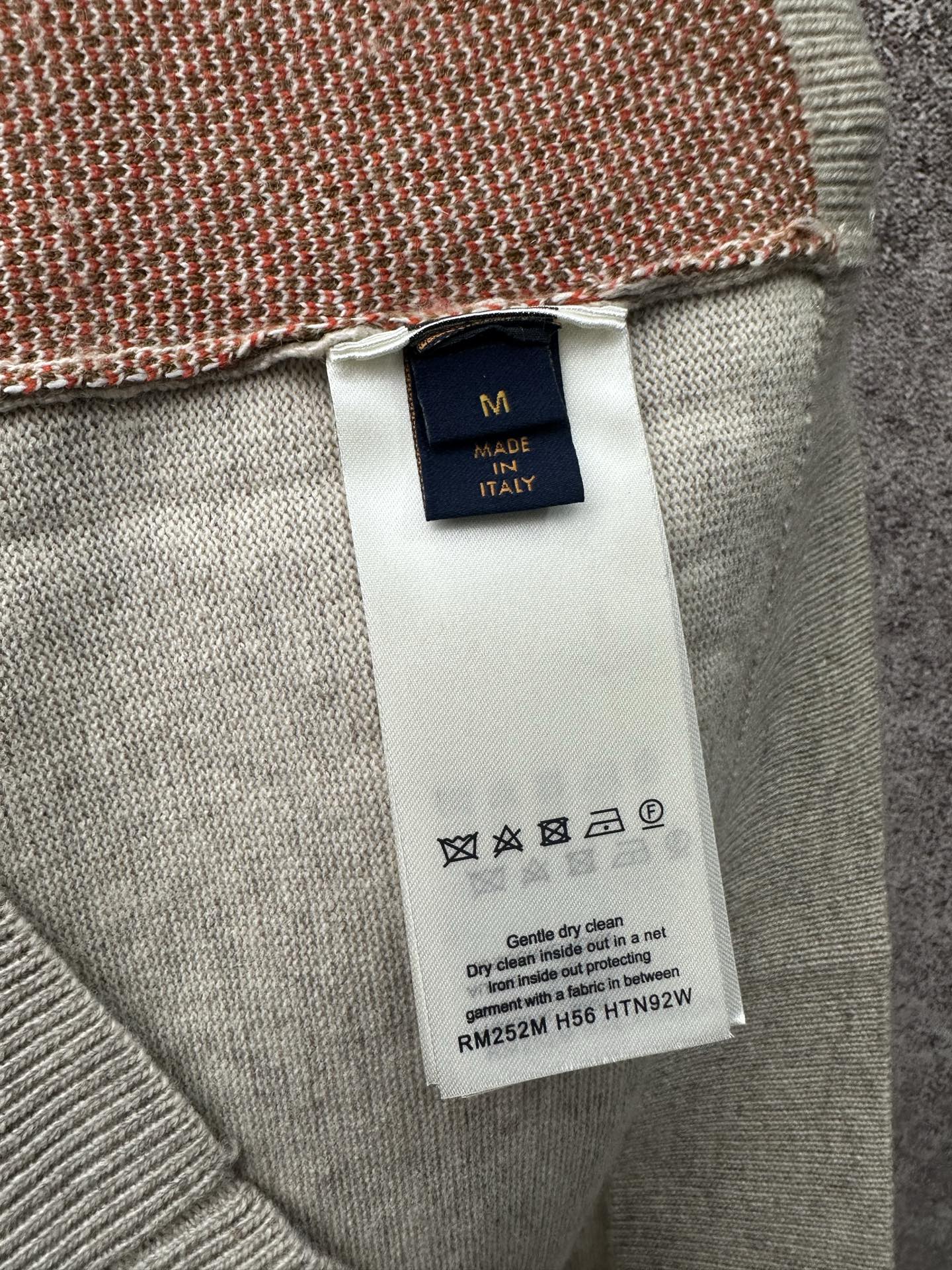 Louis Vuitton size M and care label on light gray sleeveless knit top, Italy