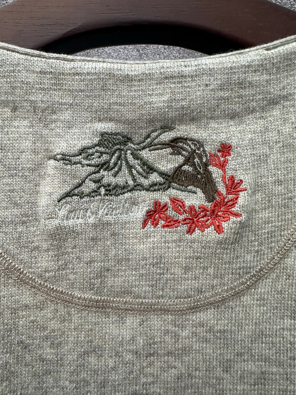 Louis Vuitton embroidered chest graphic on light gray sleeveless knit top
