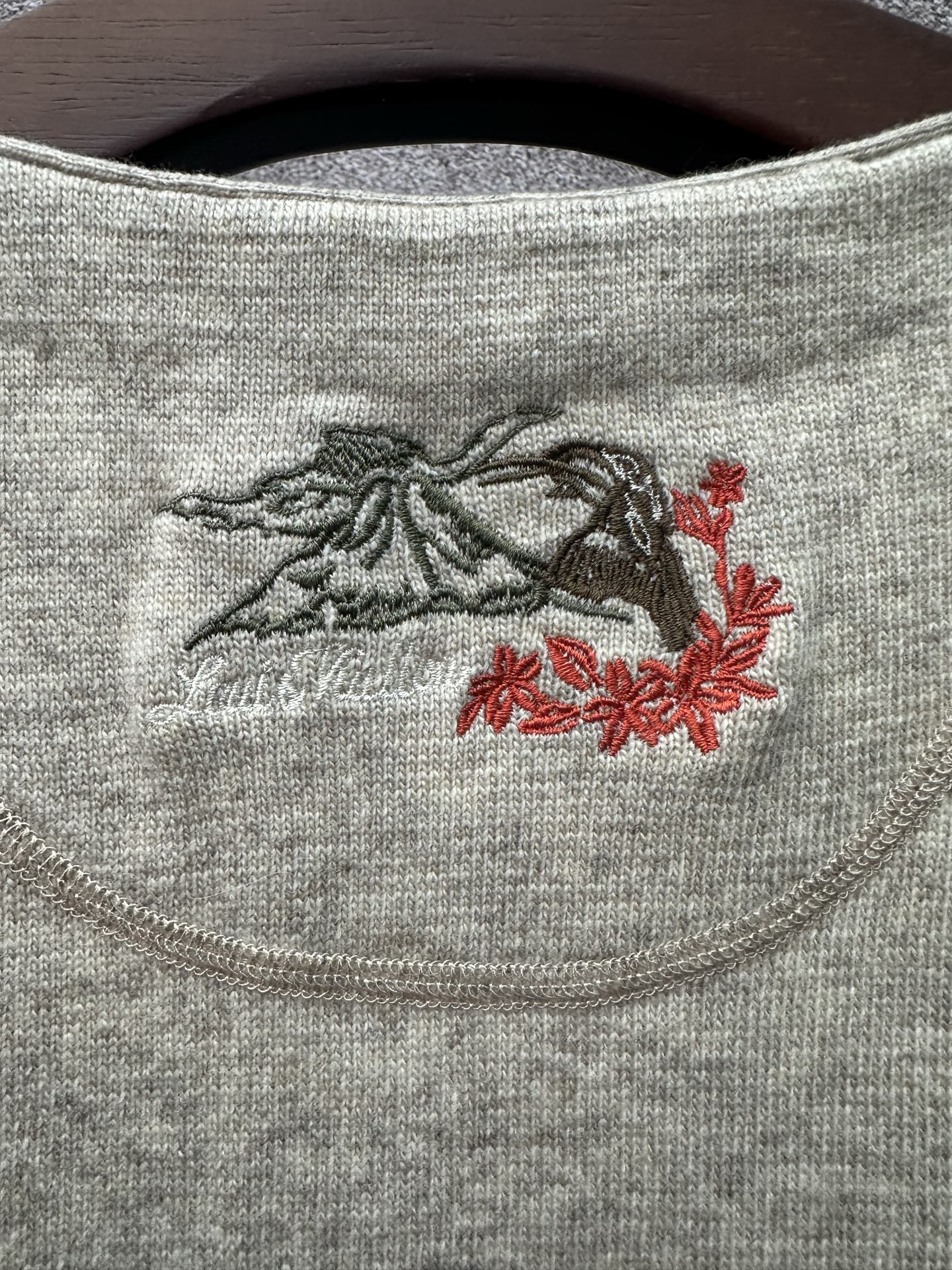 Louis Vuitton embroidered chest graphic on light gray sleeveless knit top