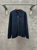 Dark blue long-sleeve zip jacket with pointed collar and gold zipper