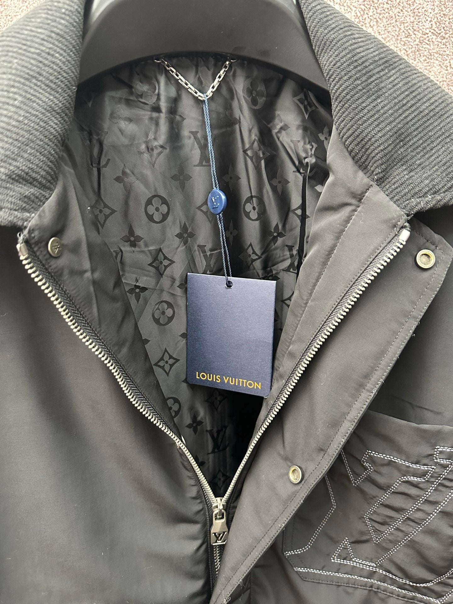 Louis Vuitton long coat, gray monogram-lined hood and front zipper