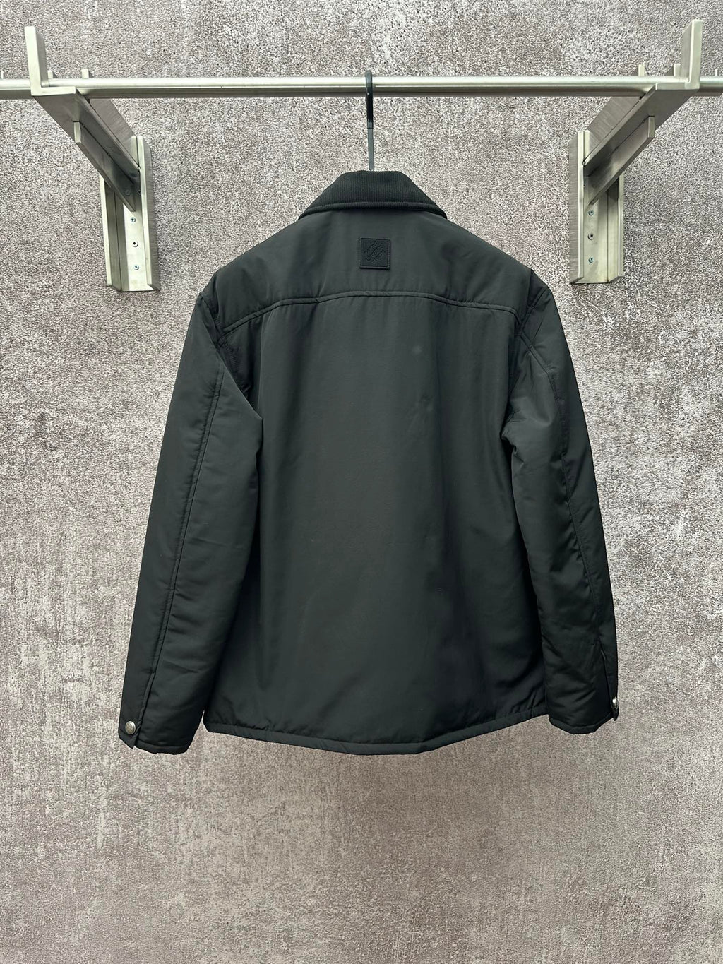 Long puffer jacket, dark green, back view with collar and buttoned placket