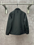 Long puffer jacket, dark green, back view with collar and buttoned placket