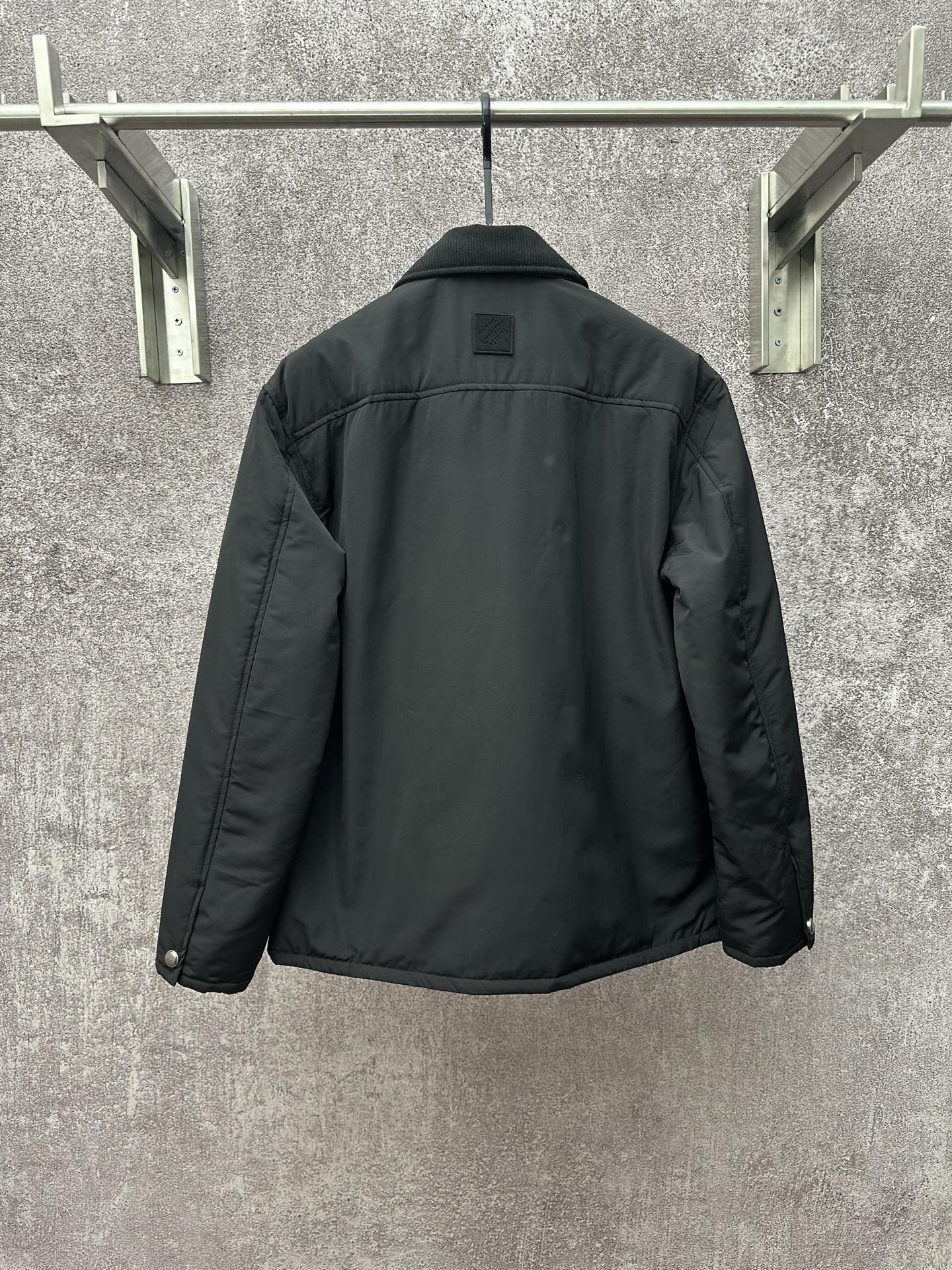 Long puffer jacket, dark green, back view with collar and buttoned placket