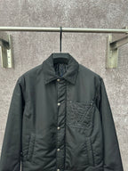 Long puffer jacket, dark green, front view with button closure and logo chest pocket