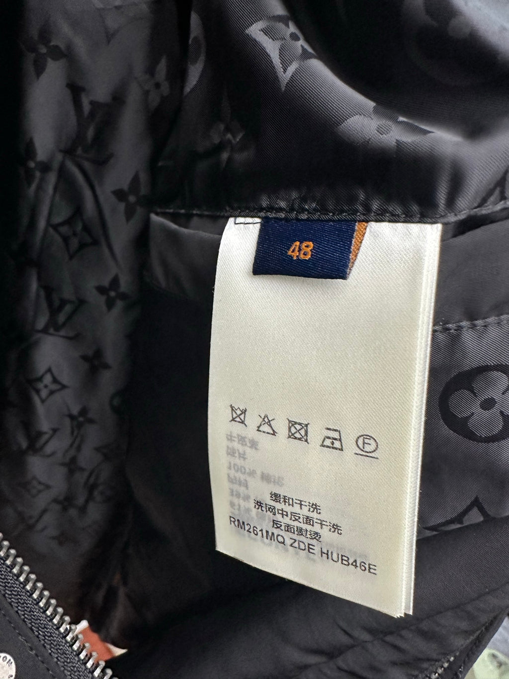 Long coat interior size label 48 on dark monogram lining