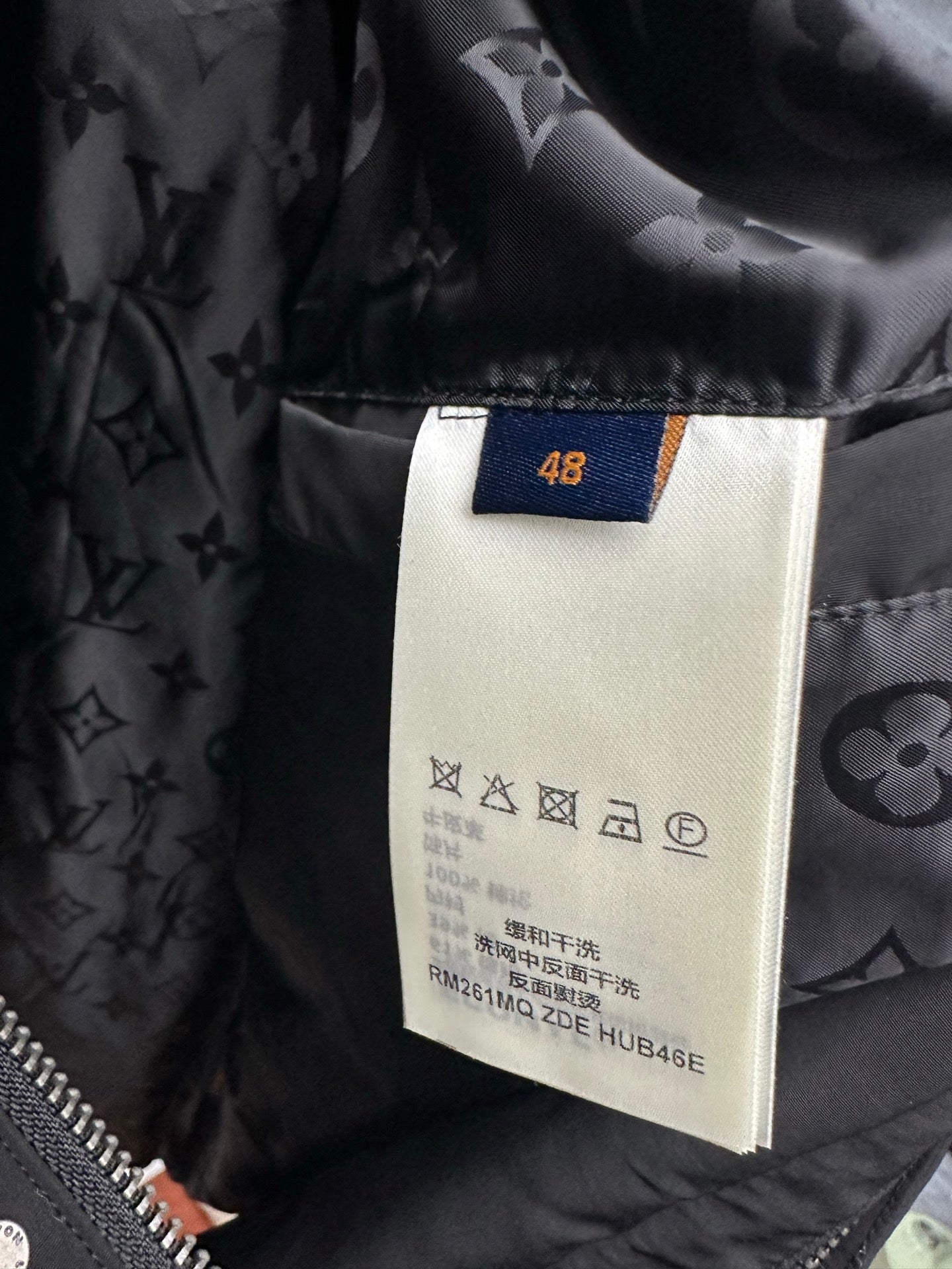 Long coat interior size label 48 on dark monogram lining