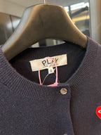 Dark navy knit cardigan neckline with PLAY label, button front, and pink drawstring accents