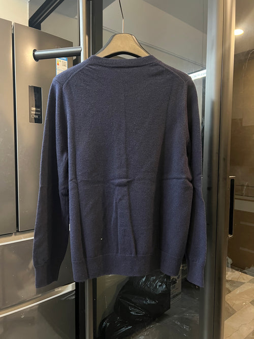 Dark navy knit cardigan, back view with ribbed collar and buttoned hem