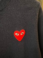 Red heart applique on dark navy knit cardigan chest