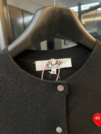 Amiri PLAY cardigan neckline with button placket and red heart logo.