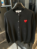 Amiri cardigan in dark knit with button front and red heart logo patch.