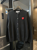 Amiri cardigan in dark knit with button front and red heart logo patch.