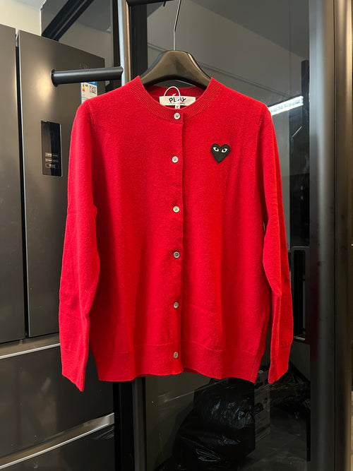 Red knit cardigan sweater with button front and black cat-face heart applique