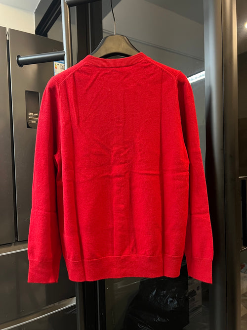 Red knit cardigan sweater back view with ribbed crew neck and long sleeves