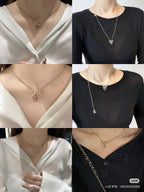 Gold-tone bow pendant necklace worn on neckline, shown from multiple angles