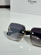 Celine sunglasses with dark lenses and gold-tone hinges, square cat-eye profile view