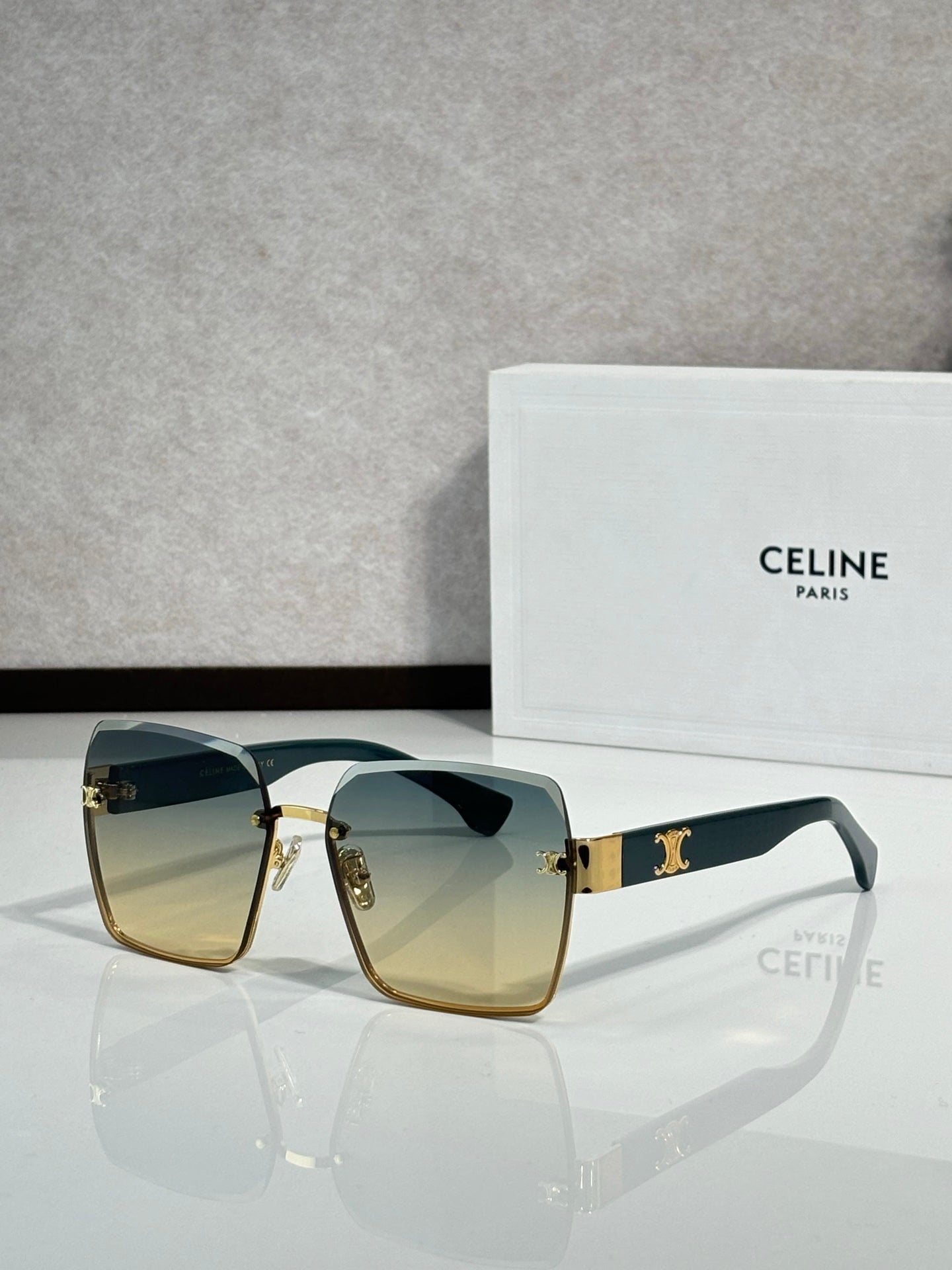 Celine sunglasses with gold-tone frame and amber gradient lenses, square cat-eye