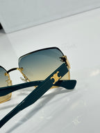 Celine sunglasses side view with gold-tone arms and gradient lenses, square cat-eye