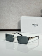 Celine sunglasses with dark rectangular lenses, black frame, and gold bridge accents