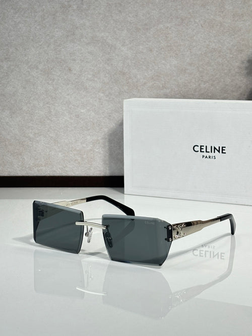 Celine sunglasses with dark rectangular lenses, black frame, and gold bridge accents