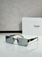 Celine sunglasses with dark rectangular lenses, black frame, and gold-tone temple tips