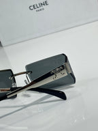 Celine sunglasses with dark rectangular lenses, black frame, and silver temple emblem