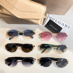 Sunglasses set with blue, pink, black, and green-tinted lenses and gold-tone frames