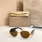 Brown-tinted gradient sunglasses with gold-tone frame and tortoiseshell-style temple arms