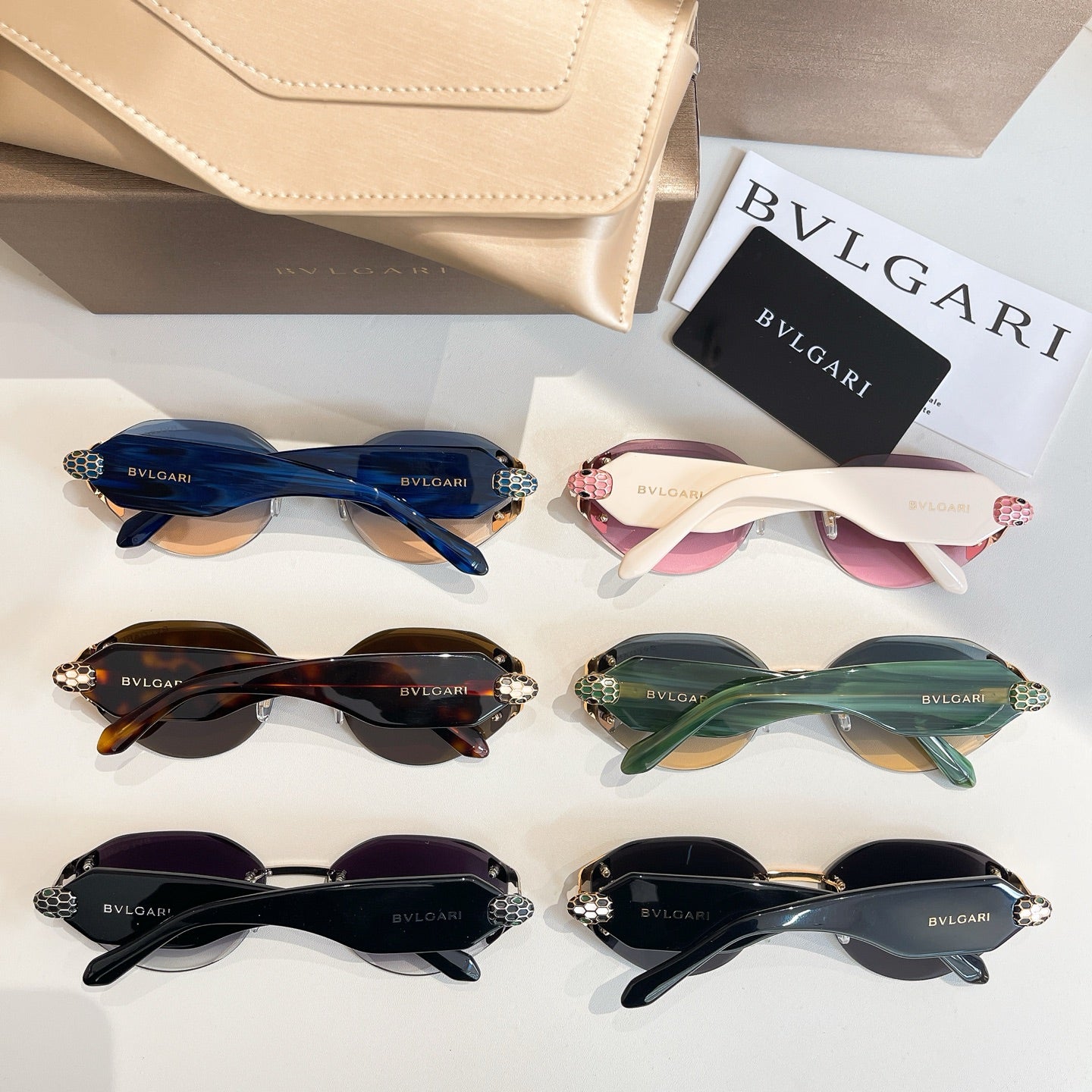 Sunglasses set with blue, pink, green, purple, and black tinted lenses and gold-tone frames