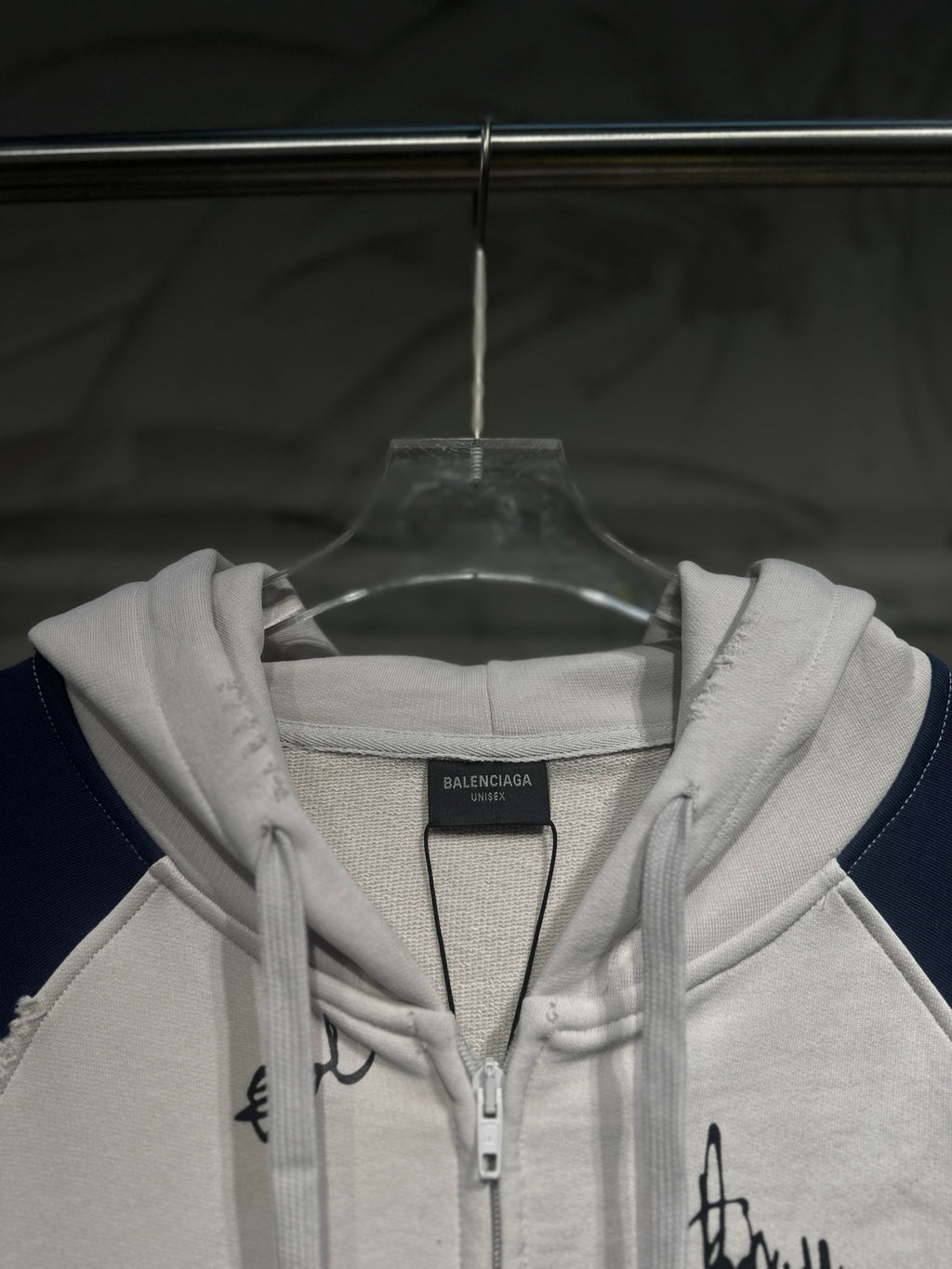 Zip-up hoodie chest view with hood drawstrings and front zipper closure
