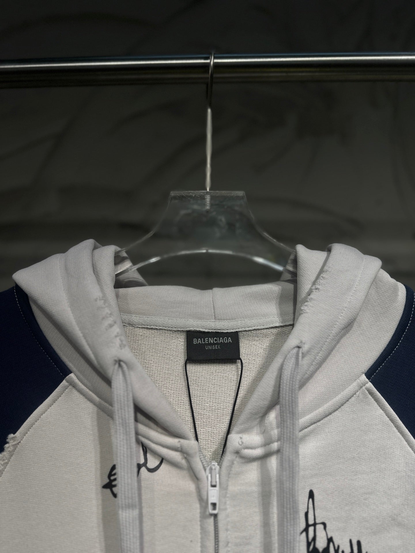 Zip-up hoodie chest view with hood drawstrings and front zipper closure