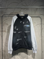 Two-tone zip-up hoodie with hood; black body, gray sleeves, white script logo prints