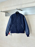 Navy monogram bomber jacket with zip front and ribbed collar, cuffs, hem.