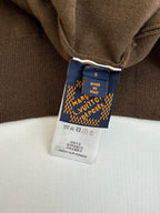 Brown jacket neck label showing size S and Louis Vuitton made in Italy