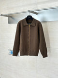 Brown zip-up jacket with stand collar and full-length gold zipper on hanger