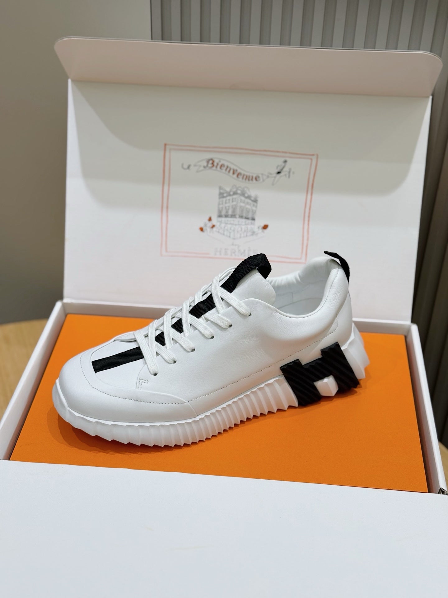 Unisex white sneakers with black stripe accents, side view, lace-up