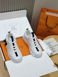 Unisex white sneakers with black stripe and lace-up design, chunky sole