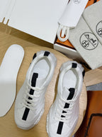 Unisex white sneakers with black stripe, toe and collar detail, lace-up