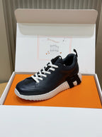 Unisex dark navy lace-up sneakers with white laces, ribbed heel tab, and thick sole