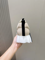 Hermes unisex sneakers heel view, light cream with black strap detail