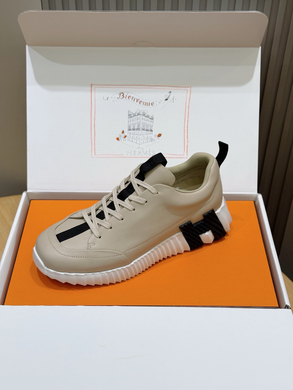Hermes unisex sneakers, light cream uppers with black stripes and chunky white sole