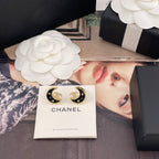 Crescent moon stud earrings, gold-tone with black enamel and rhinestone detailing